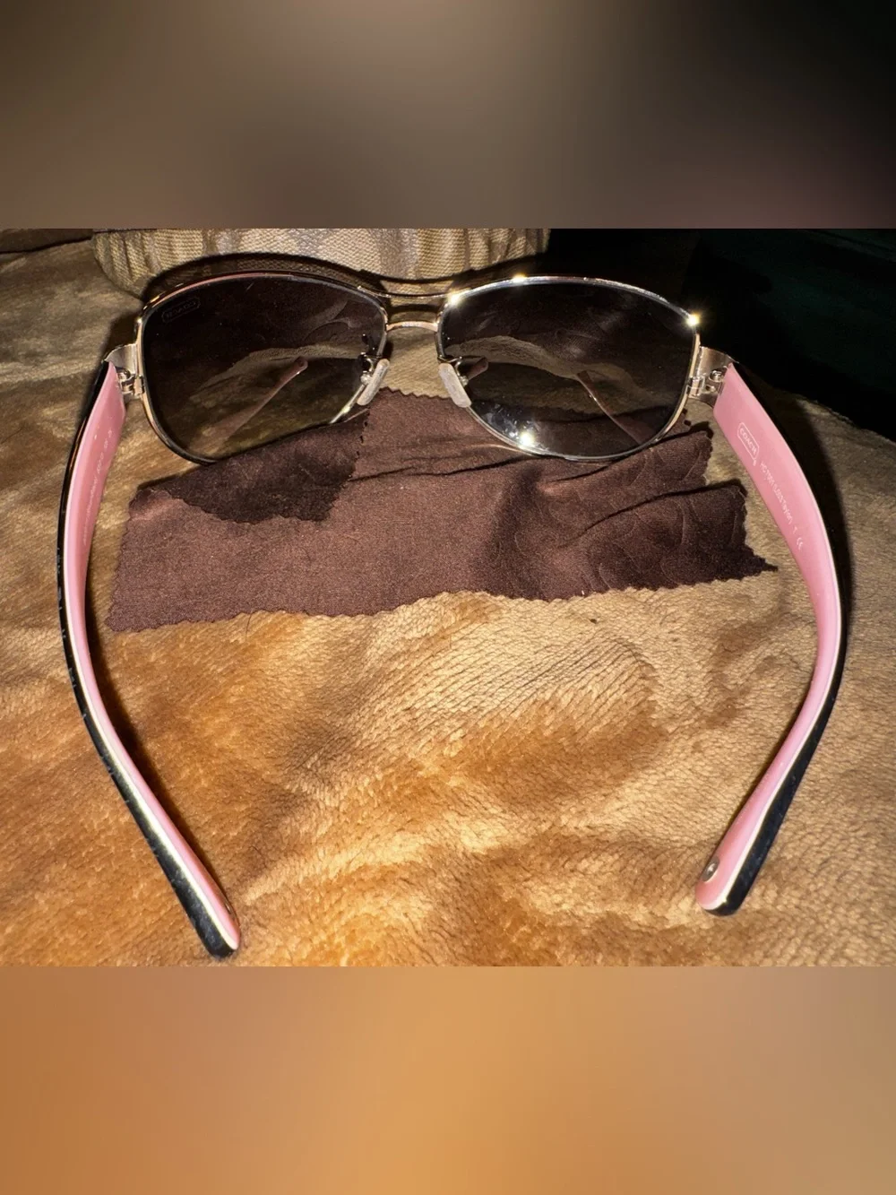 Coach aviator sunglasses with brown lenses and pink temples